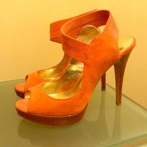 Coral colored suede heels.